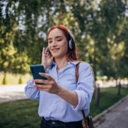 Woman talks on phone in park