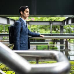 Man wearing hearing aids in an office building.