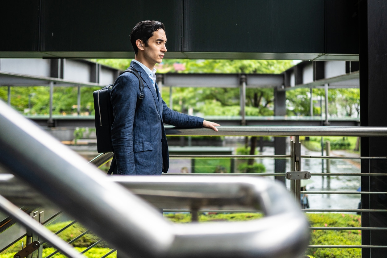 Man wearing hearing aids in an office building.